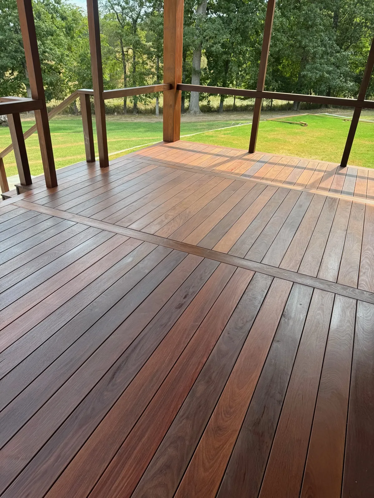 Covered ipe deck overlooking an open lawn