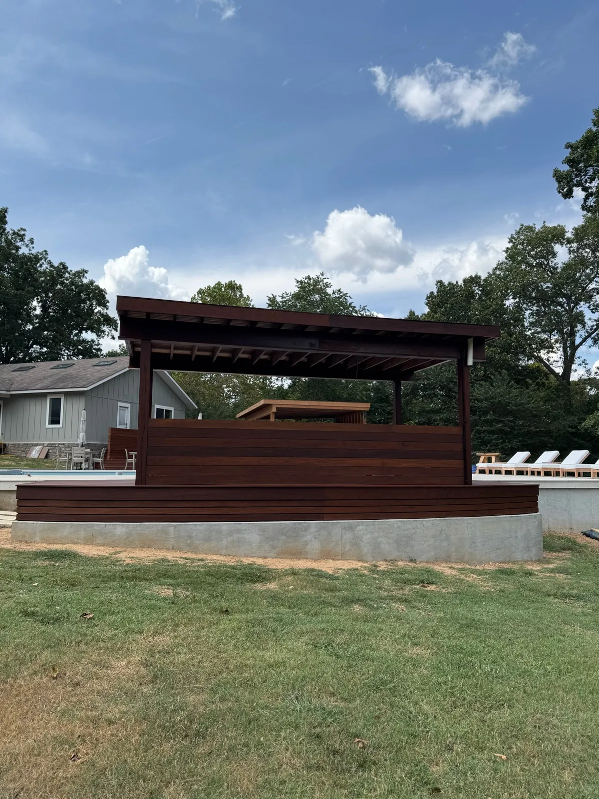 Ipe pergola pavilion beside pool and guest house